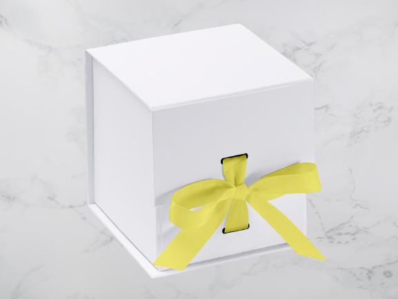 White_Cube_Yellow_Ribbon_0302cee8-20c3-45f5-b39e-64ac7a69aab9_2000x-removebg-preview